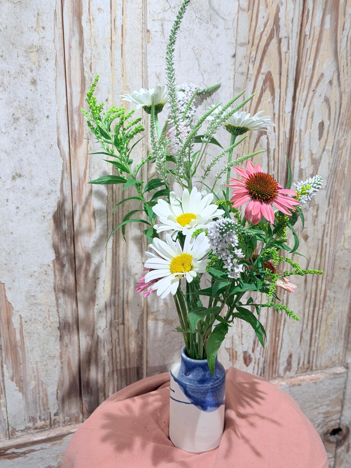 Seasonal event flower bud vases with flowers arranged